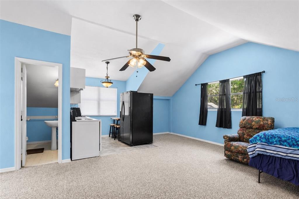 8386 Austin Road Melrose, FL 32666 - Photo 62 of 76 a living room with furniture and windows