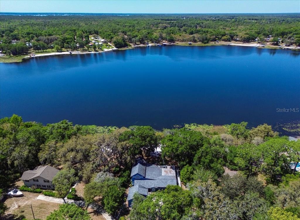 8386 Austin Road Melrose, FL 32666 - Photo 74 of 76 an aerial view of a houses with a yard and lake view