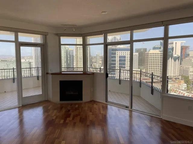 a bedroom with a bed and a couch next to a window
