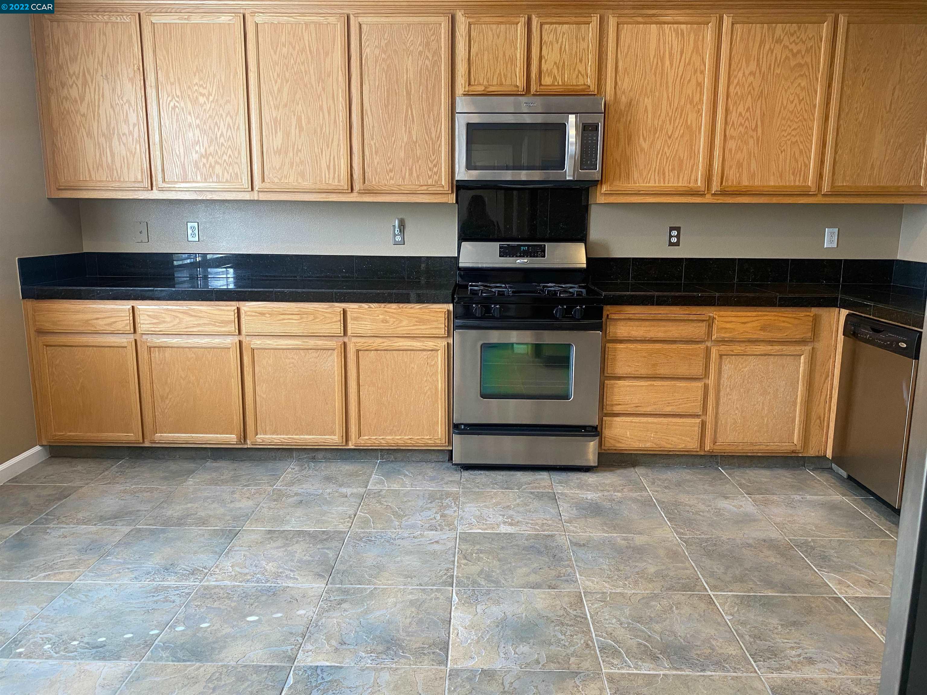 1317 Amaryllis Circle San Ramon, CA 94582 - Photo 11 of 24 a kitchen with stainless steel appliances granite countertop a stove a sink and a microwave