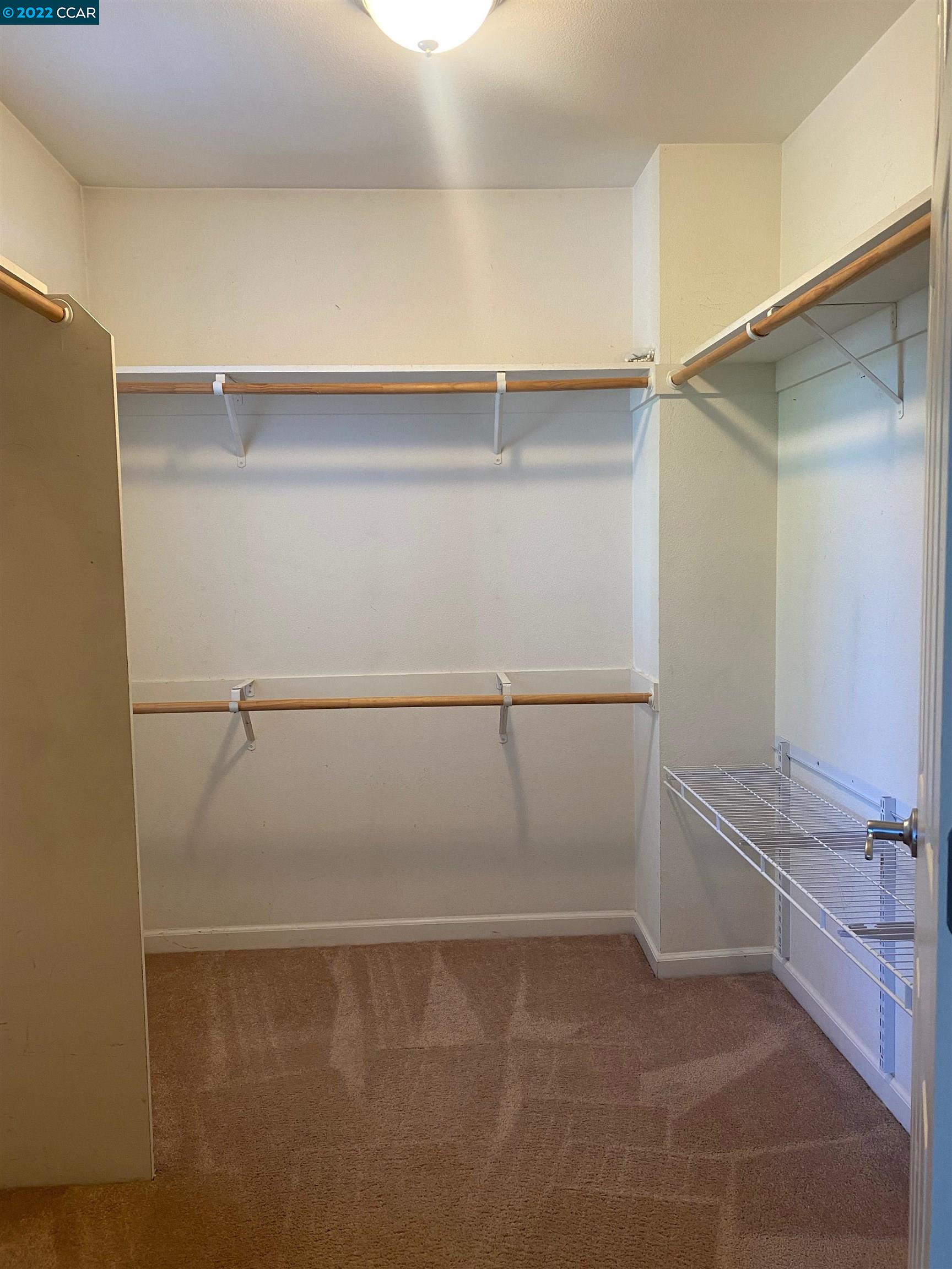 1317 Amaryllis Circle San Ramon, CA 94582 - Photo 13 of 24 a view of a room with racks on the wall