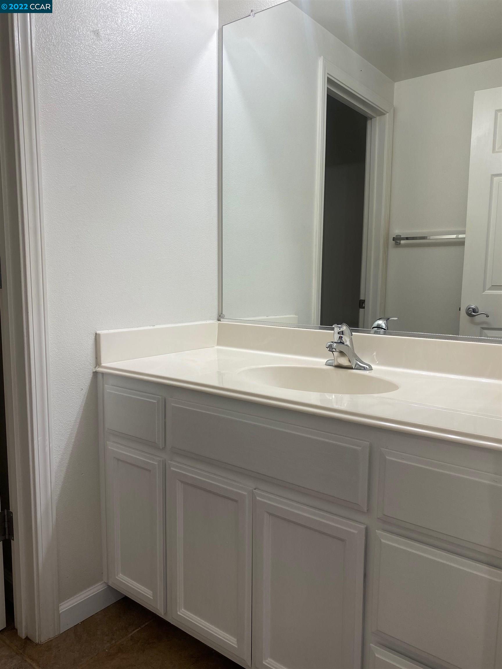 1317 Amaryllis Circle San Ramon, CA 94582 - Photo 18 of 24 a bathroom with a sink and a mirror