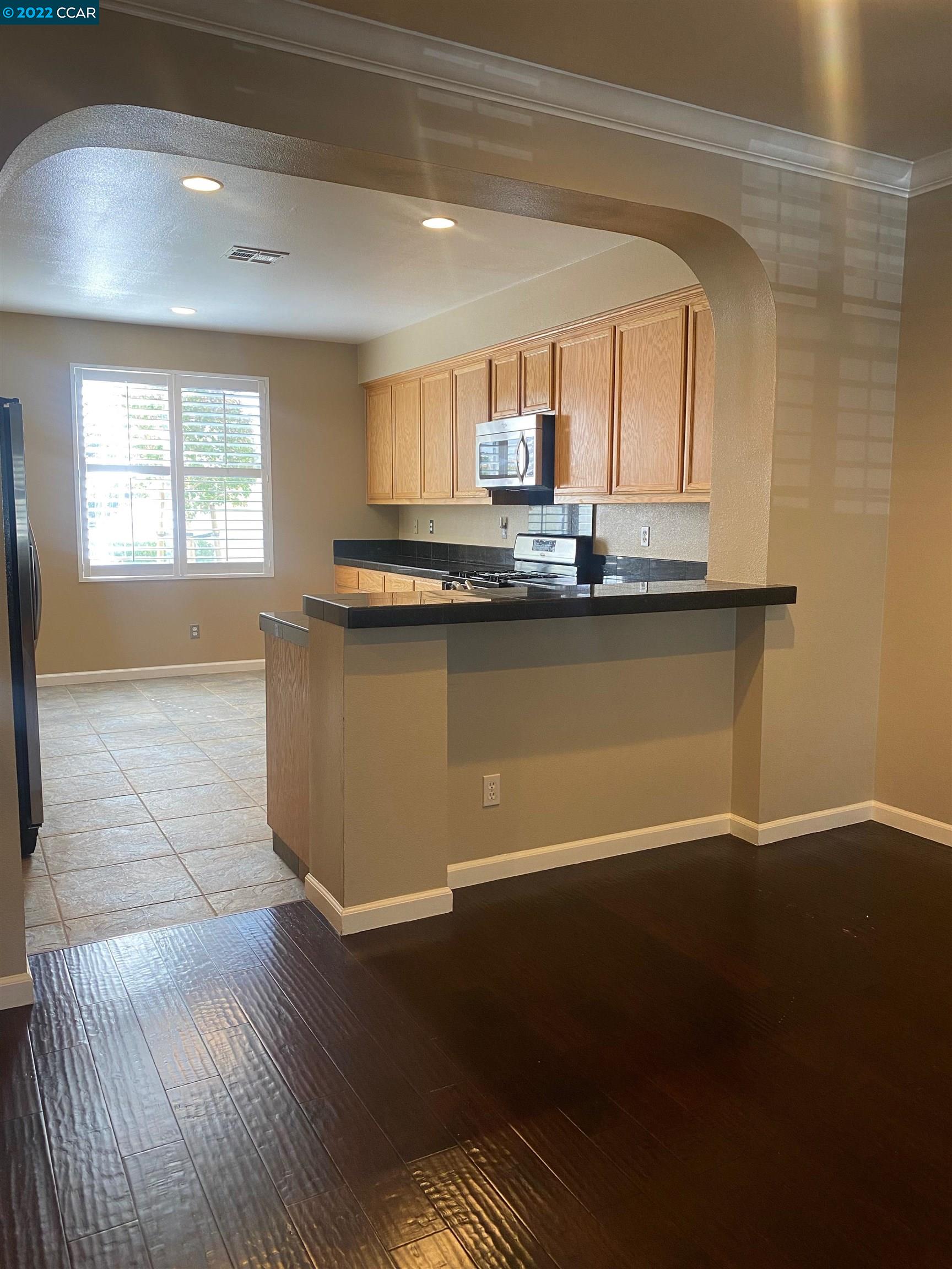 1317 Amaryllis Circle San Ramon, CA 94582 - Photo 6 of 24 a view of a kitchen with wooden floor and a sink