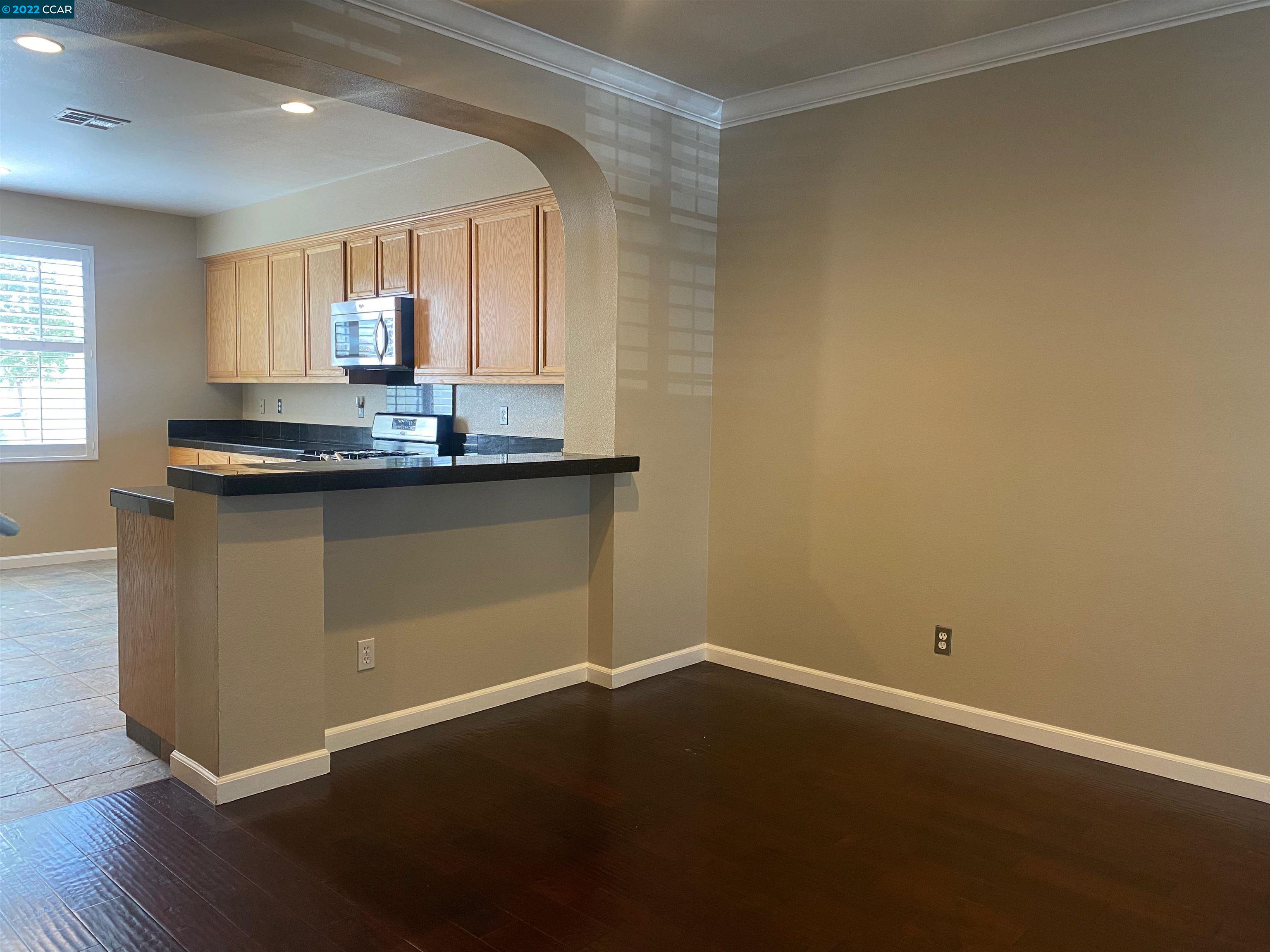 1317 Amaryllis Circle San Ramon, CA 94582 - Photo 7 of 24 a view of a kitchen with wooden floor and a sink