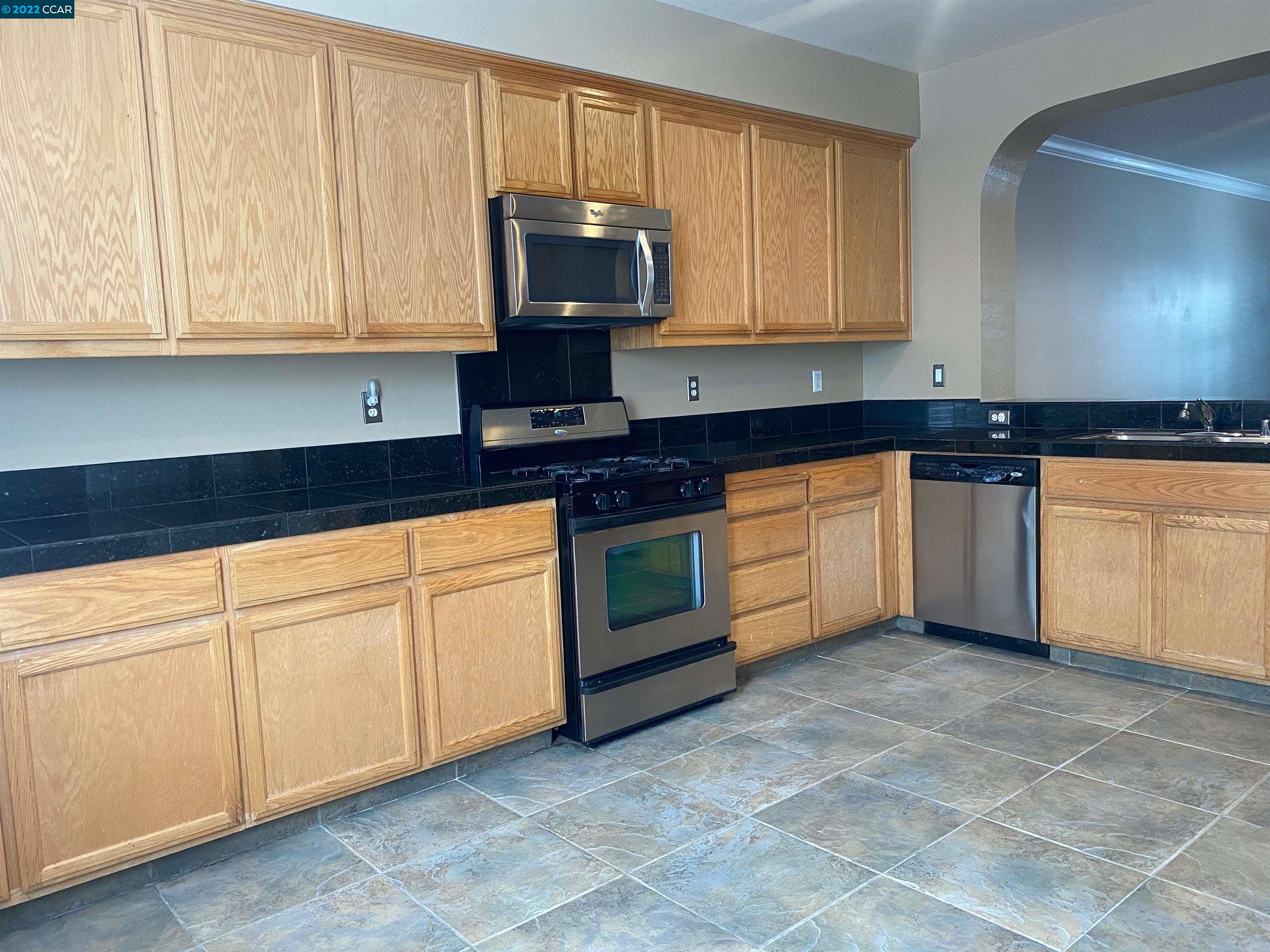 1317 Amaryllis Circle San Ramon, CA 94582 - Photo 10 of 24 a kitchen with granite countertop a sink and cabinets