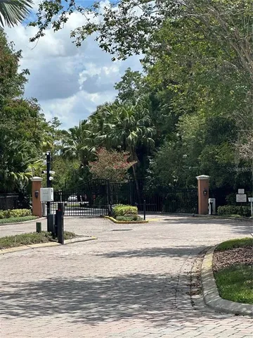 a swimming pool with trees in the background