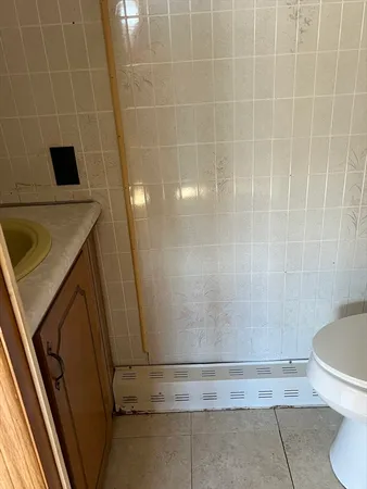 a bathroom with a sink and toilet