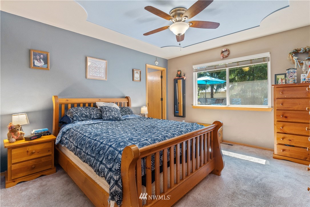5037 180th Trail Southwest Rochester, WA 98579 - Photo 12 of 38 a bedroom with a bed and a window