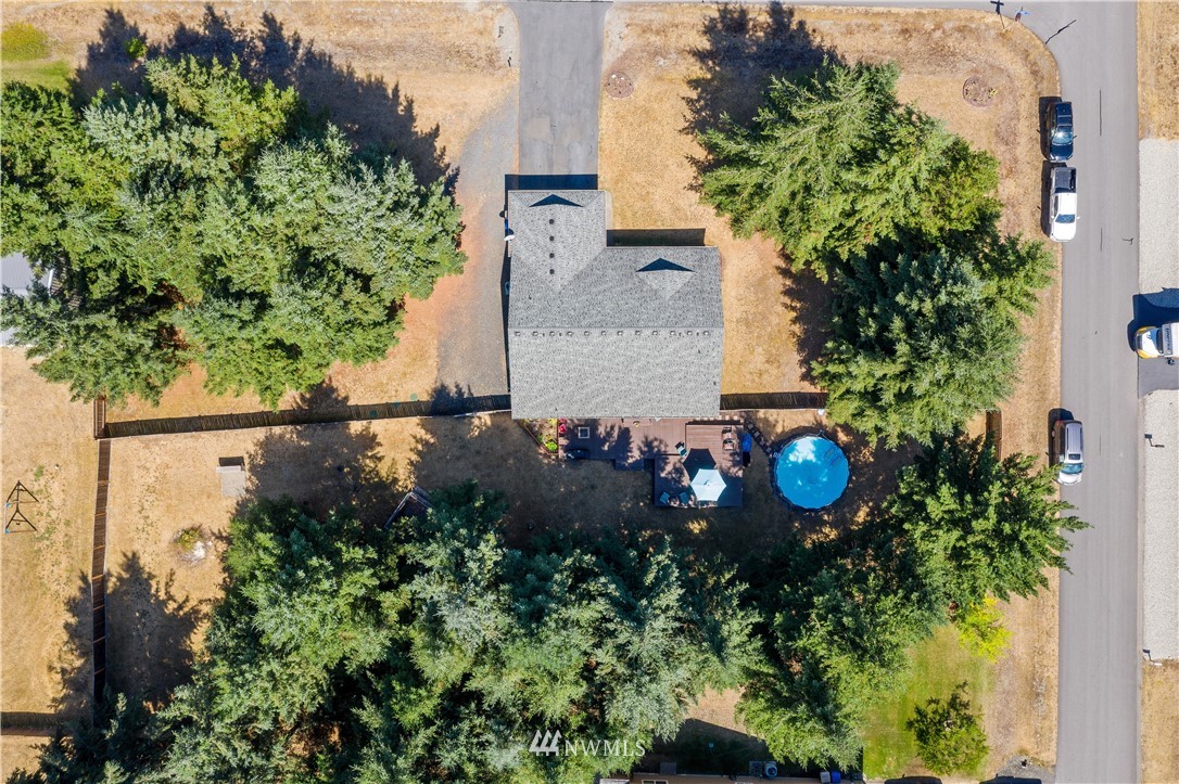 5037 180th Trail Southwest Rochester, WA 98579 - Photo 3 of 38 an aerial view of a house with garden space and street view