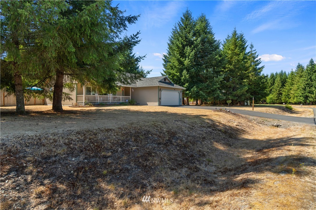5037 180th Trail Southwest Rochester, WA 98579 - Photo 27 of 38 a view of a house with a yard