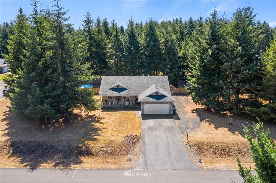 5037 180th Trail Southwest Rochester, WA 98579 - Photo 29 of 38 a view of a house with yard and sitting area