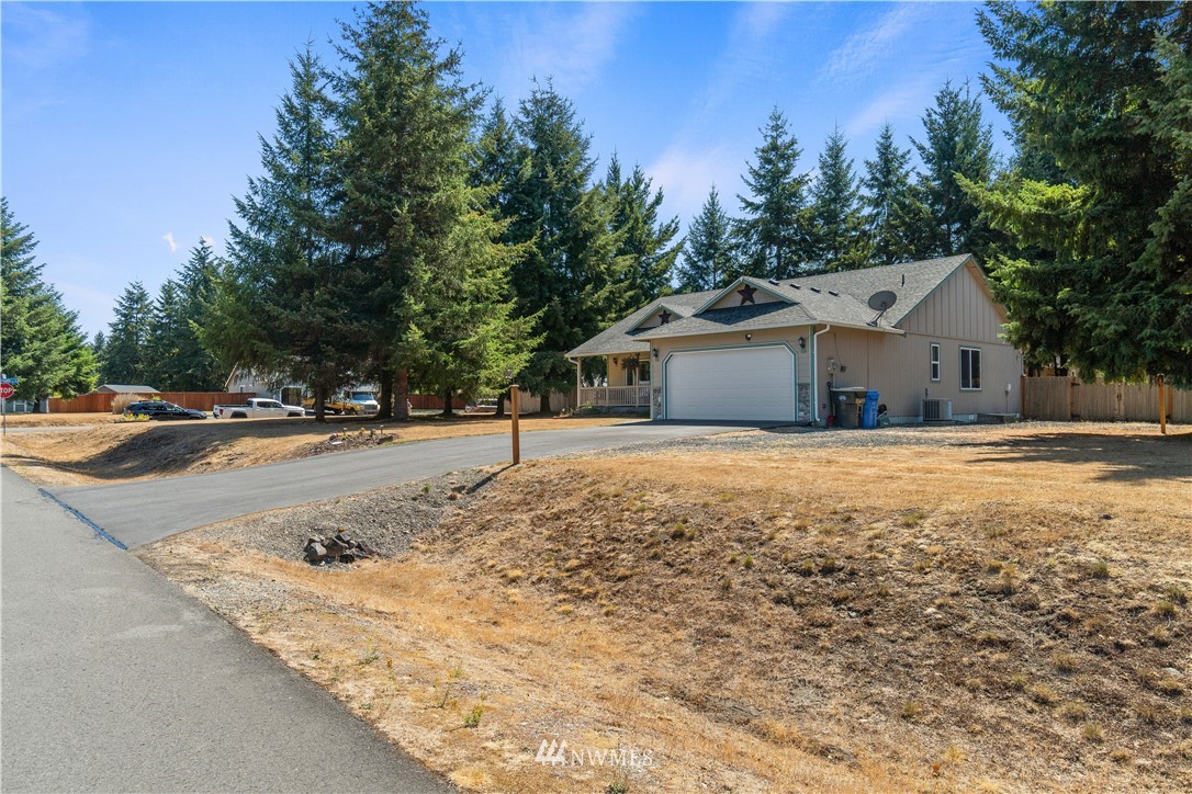 5037 180th Trail Southwest Rochester, WA 98579 - Photo 30 of 38 a house with trees in the background