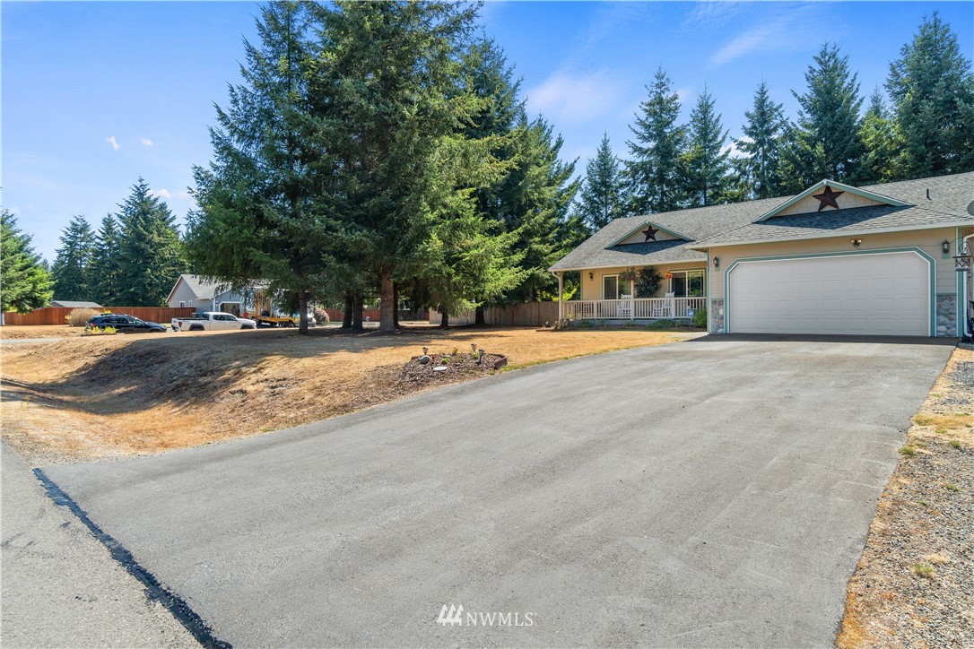 5037 180th Trail Southwest Rochester, WA 98579 - Photo 33 of 38 a view of house with outdoor space and parking