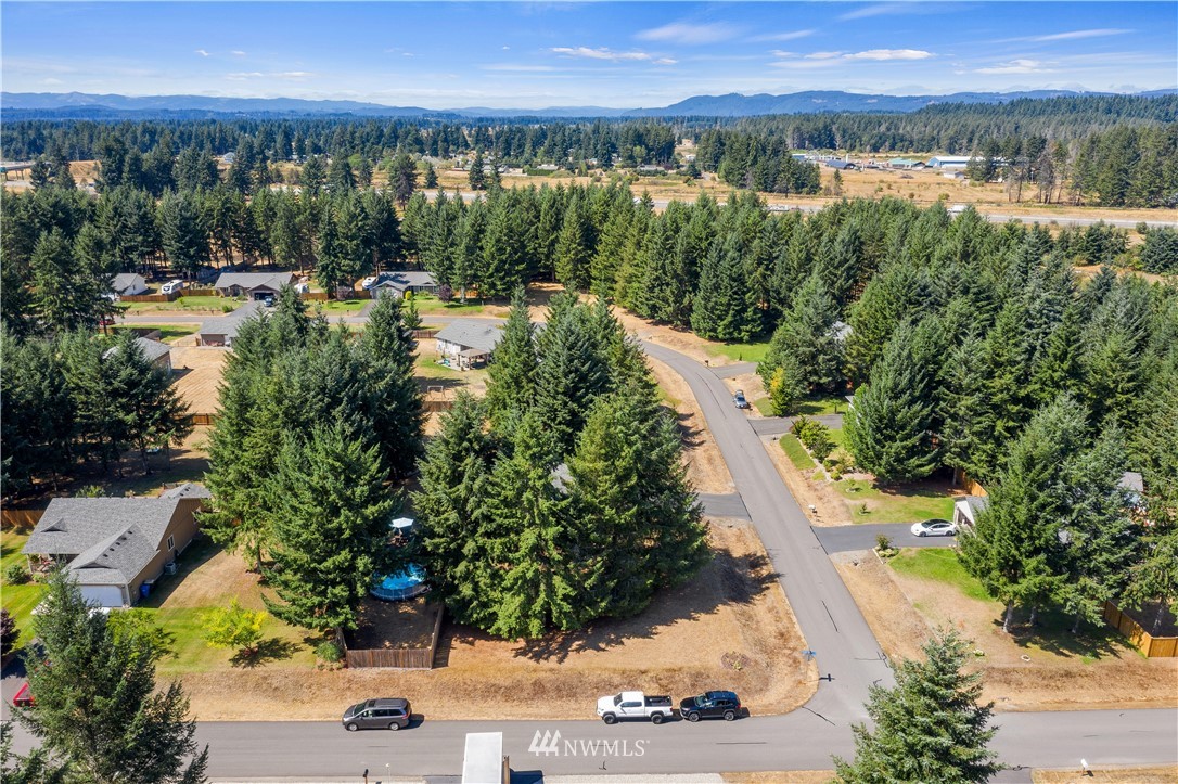 5037 180th Trail Southwest Rochester, WA 98579 - Photo 35 of 38 a view of a swimming pool with a yard
