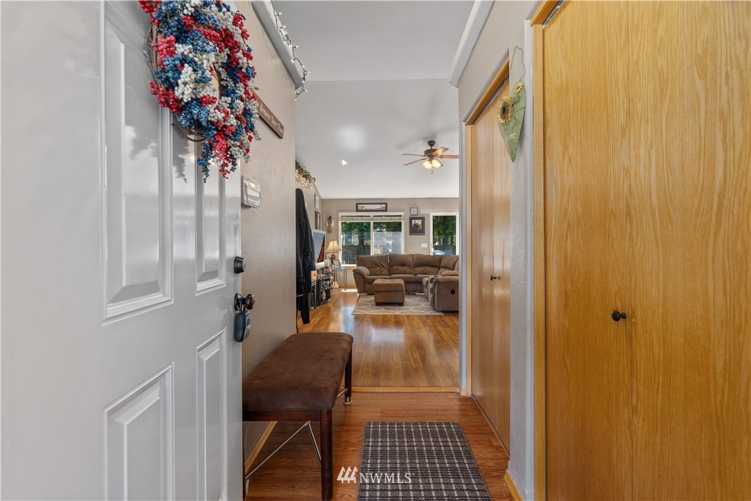 5037 180th Trail Southwest Rochester, WA 98579 - Photo 6 of 38 a view of a hallway and a livingroom with furniture