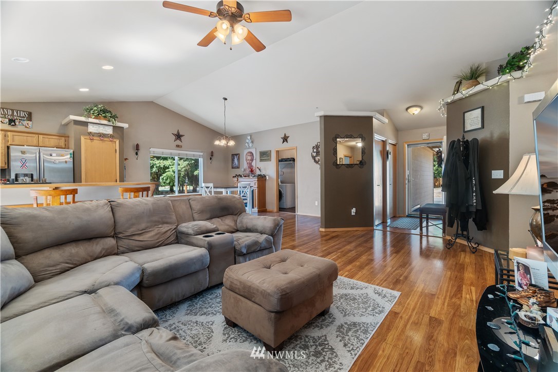 5037 180th Trail Southwest Rochester, WA 98579 - Photo 8 of 38 a living room with furniture and a wooden floor