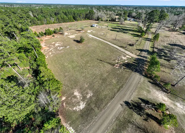 an aerial view of residential house with outdoor space