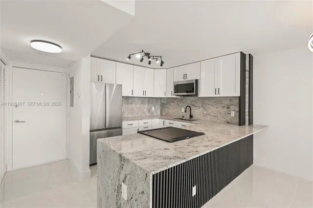 a kitchen with kitchen island cabinets and window