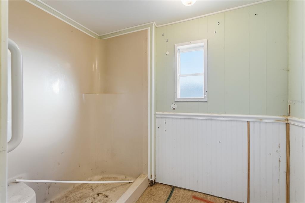 4403 Tucker Square New Port Richey, FL 34652 - Photo 15 of 20 a bathroom with a window