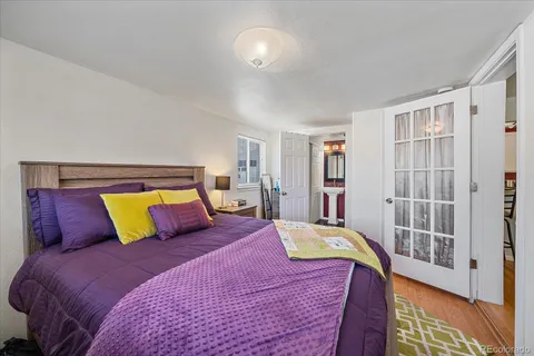a bedroom with a bed and closet