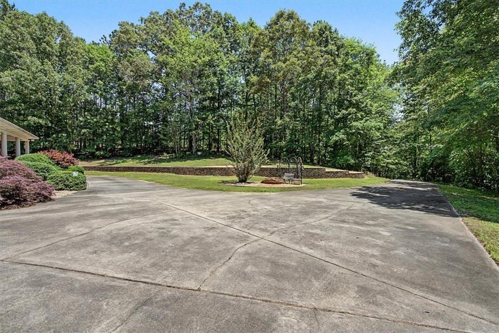 1136 Cole Lake Road Dallas, GA 30157 - Photo 8 of 72 a view of a playground with basketball court