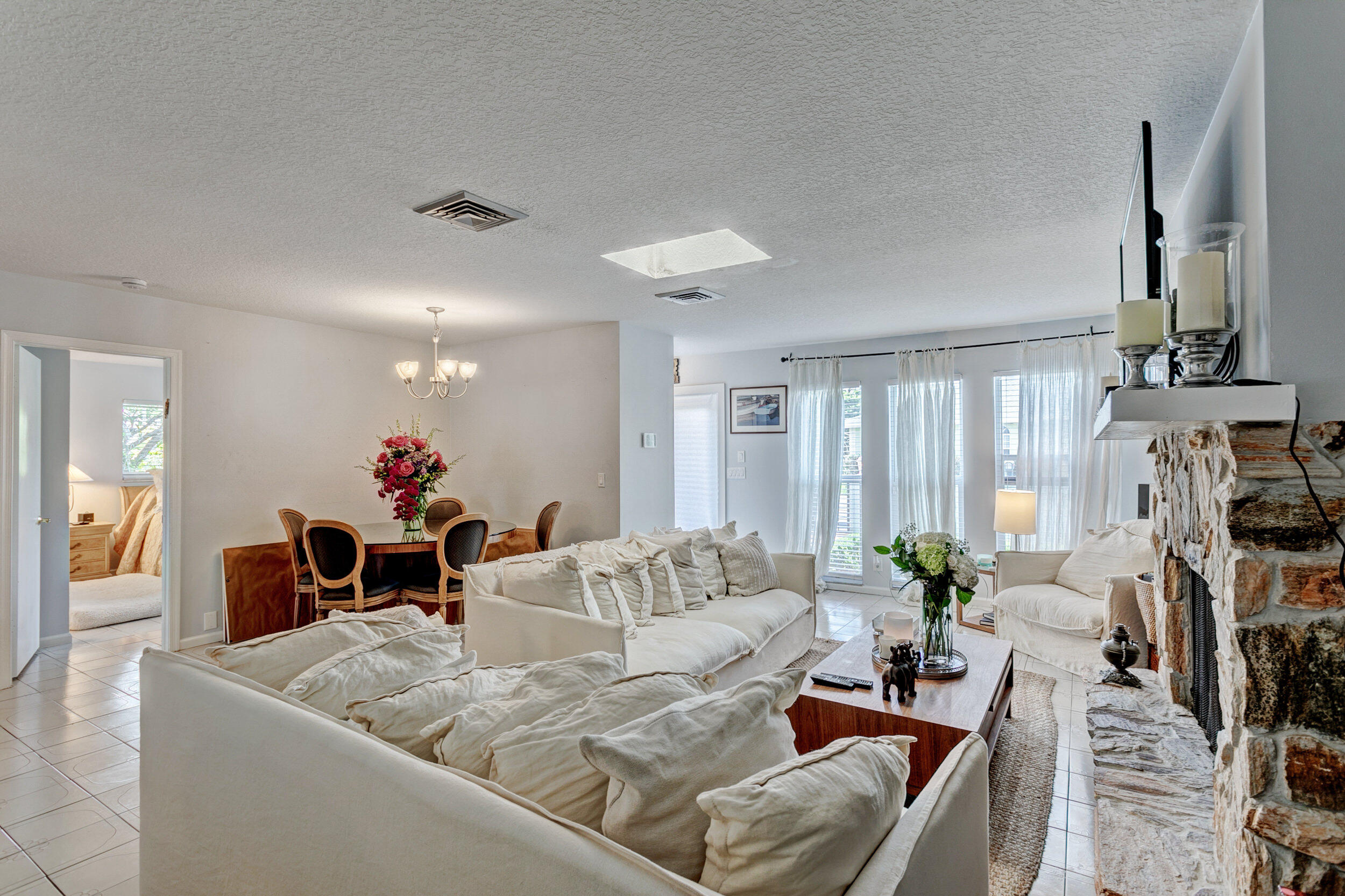 430 Mars Way Juno Beach, FL 33408 - Photo 18 of 65 a living room with furniture and a flat screen tv
