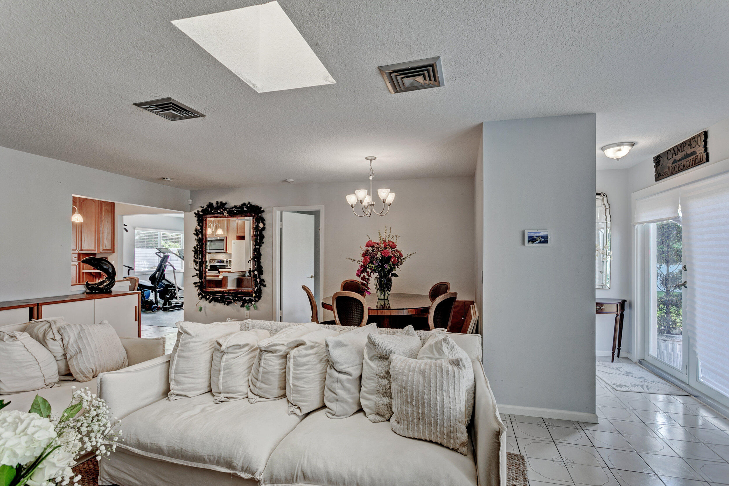 430 Mars Way Juno Beach, FL 33408 - Photo 22 of 65 a living room with furniture and a chandelier