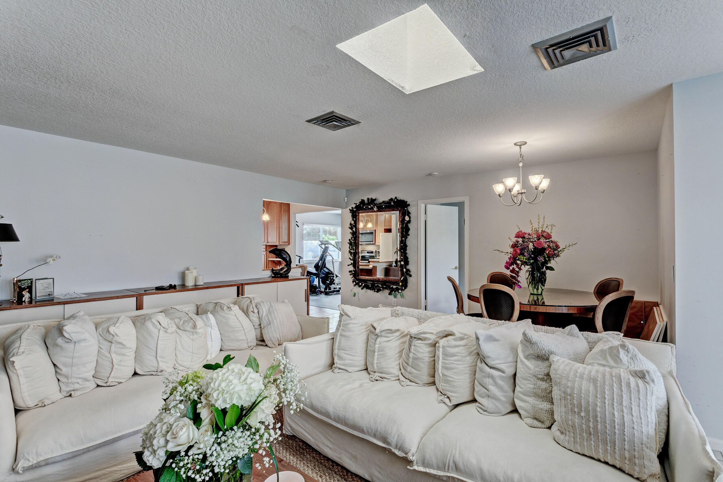 430 Mars Way Juno Beach, FL 33408 - Photo 23 of 65 a living room with furniture and a chandelier