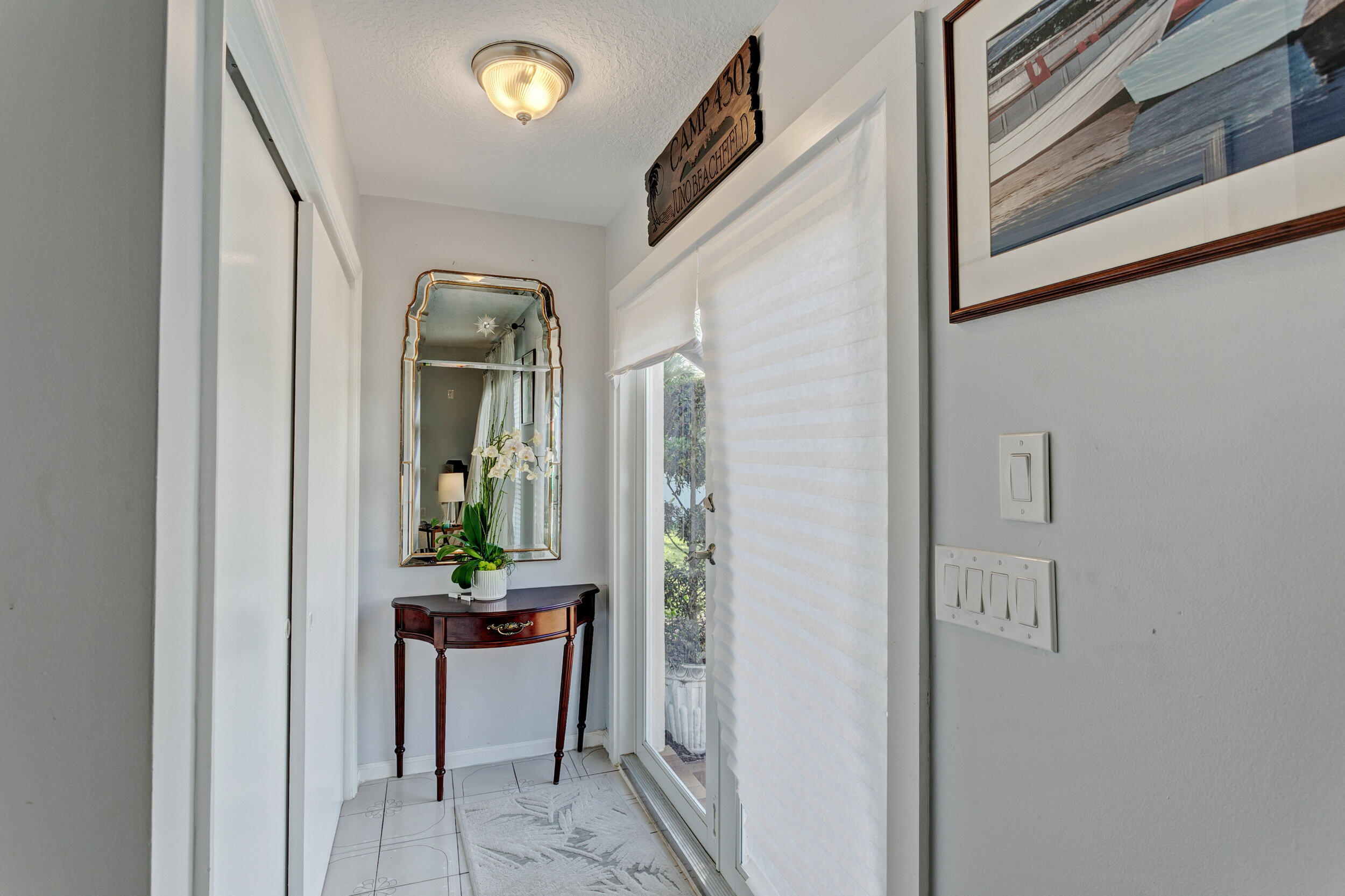 430 Mars Way Juno Beach, FL 33408 - Photo 24 of 65 a dining room with a mirror