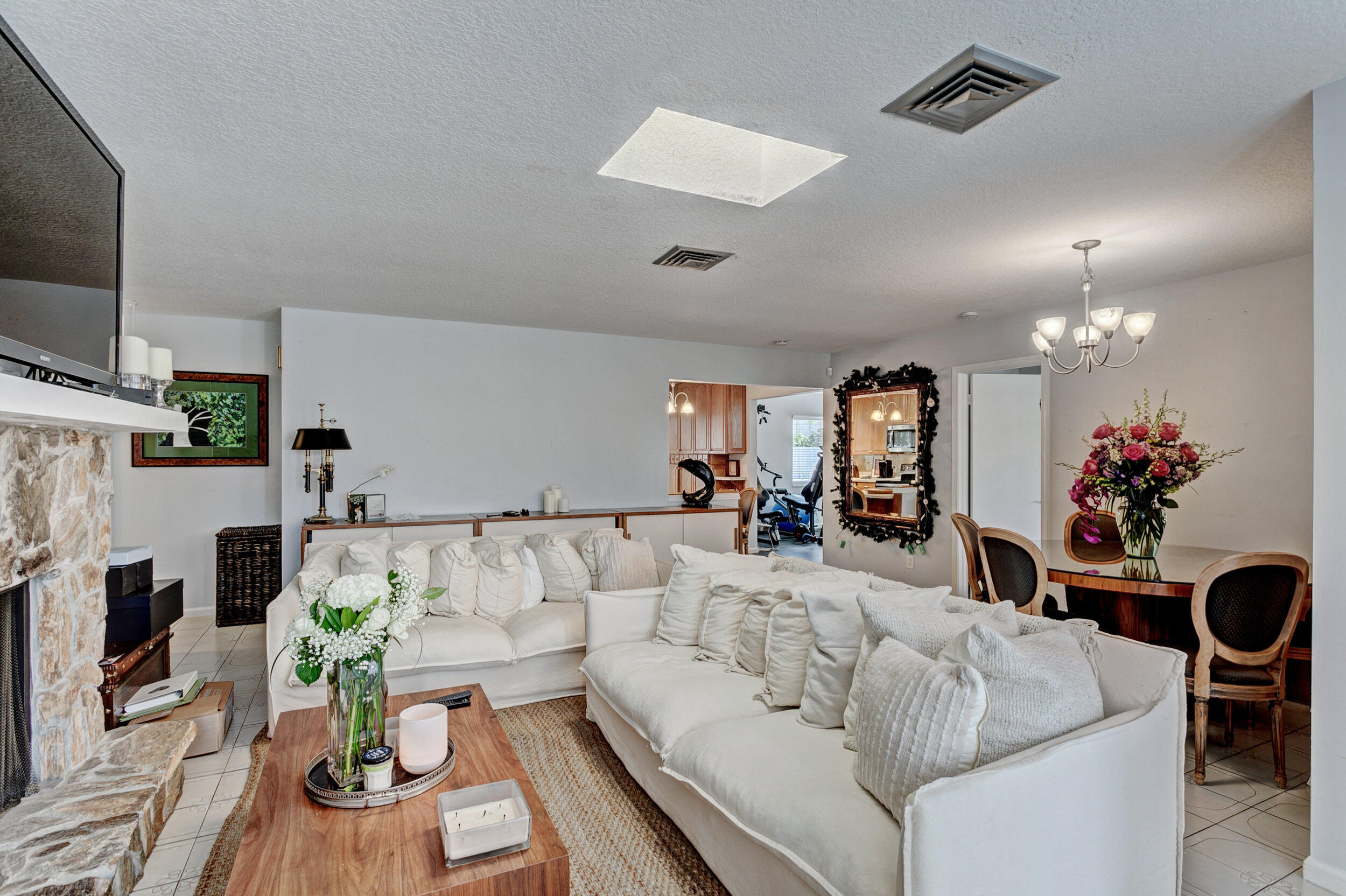 430 Mars Way Juno Beach, FL 33408 - Photo 26 of 65 a living room with furniture and a flat screen tv