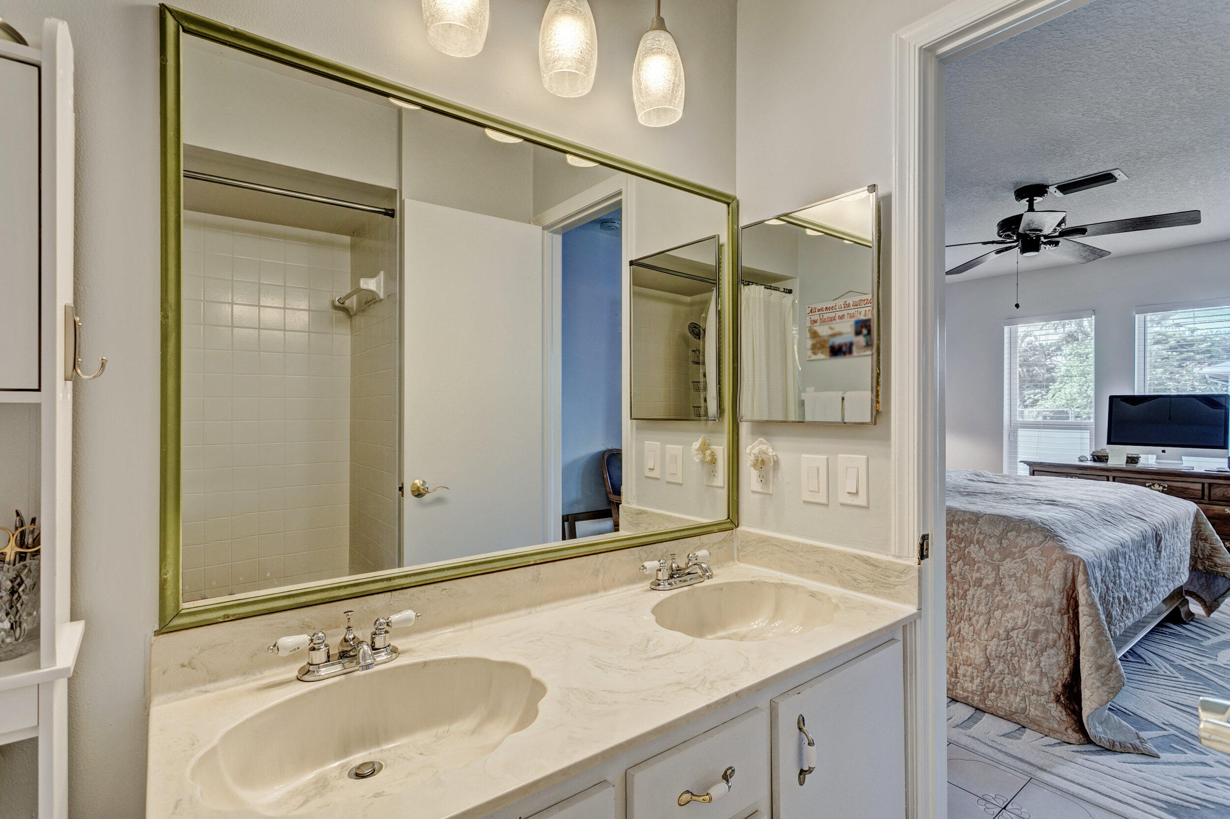 430 Mars Way Juno Beach, FL 33408 - Photo 35 of 65 a bathroom with a double vanity sink mirror and shower