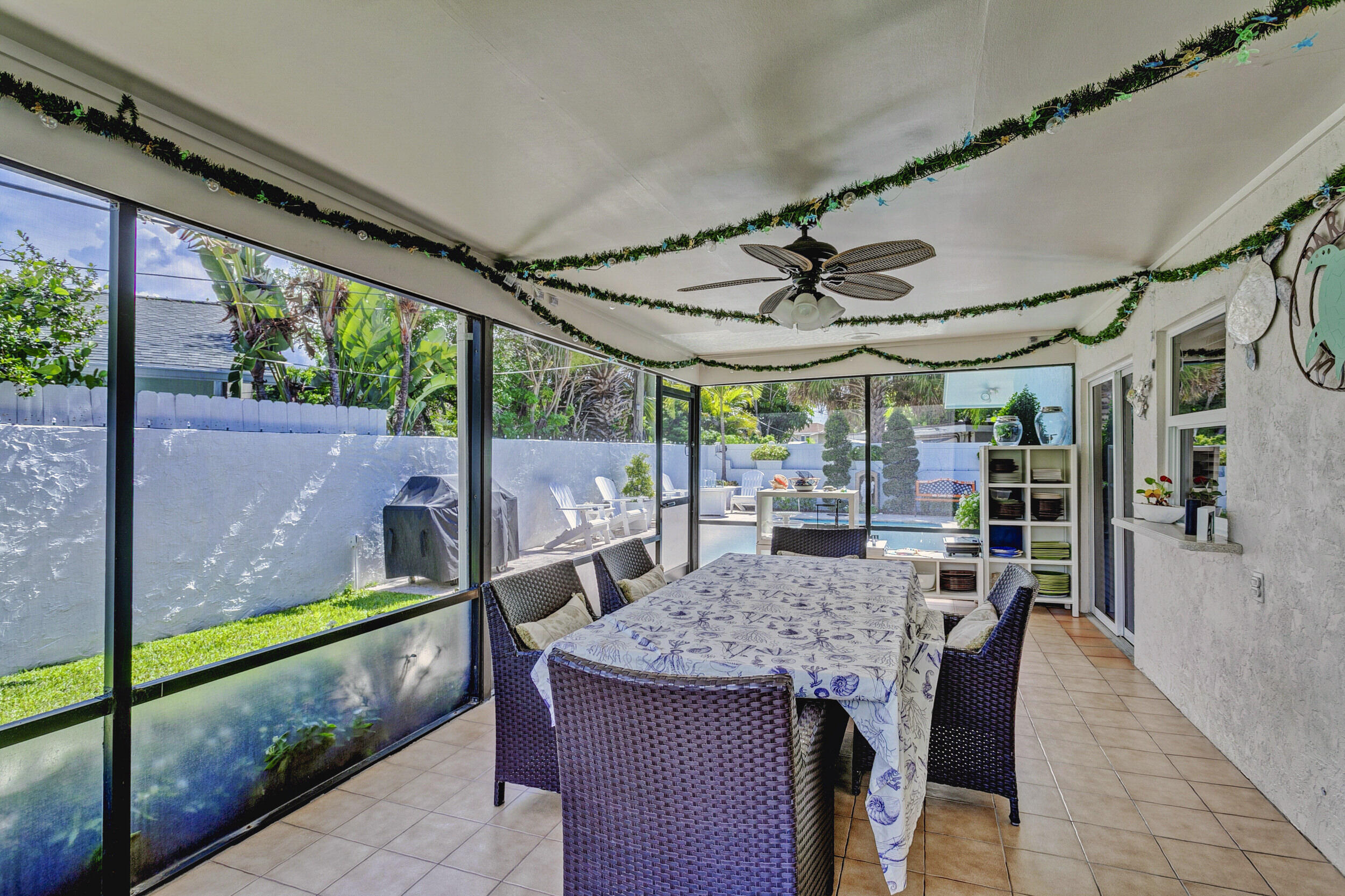 430 Mars Way Juno Beach, FL 33408 - Photo 39 of 65 a view of a patio with a table and chairs