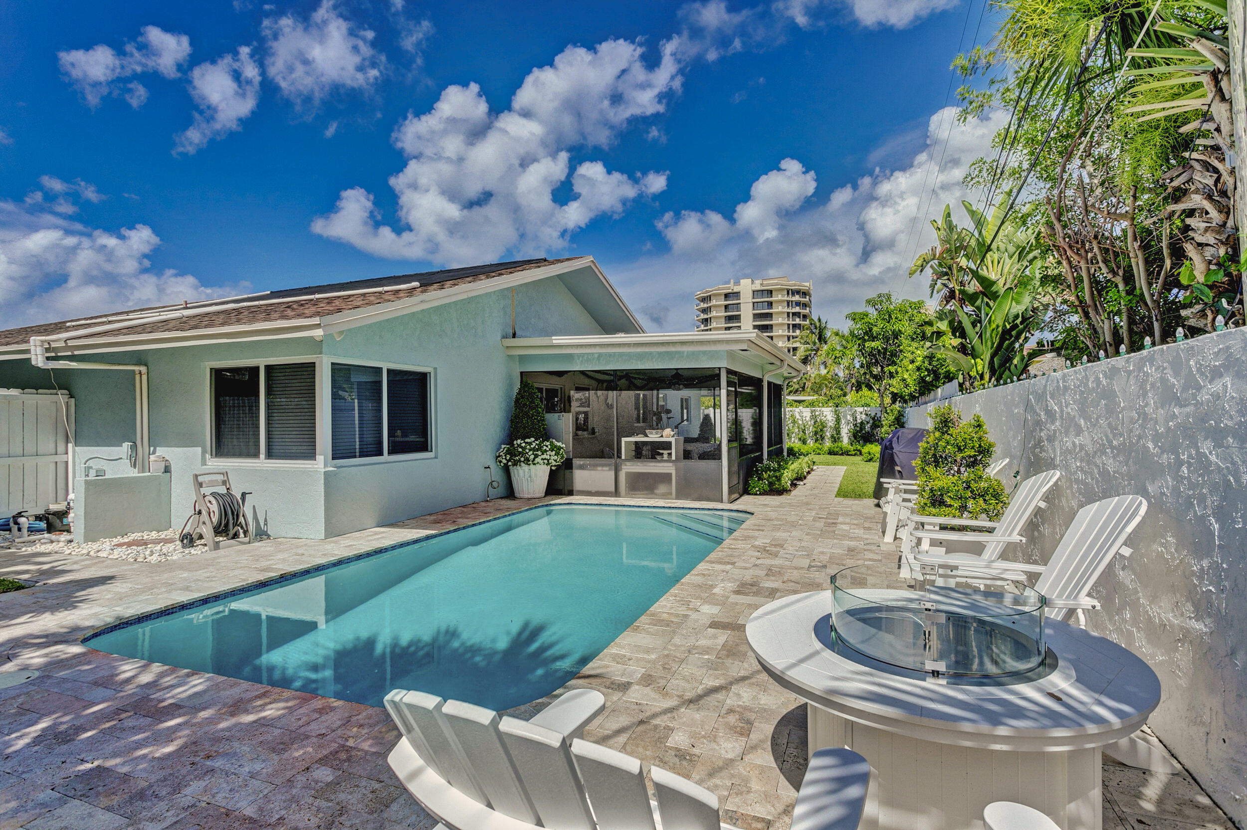 430 Mars Way Juno Beach, FL 33408 - Photo 43 of 65 a view of a house with backyard sitting area and swimming pool