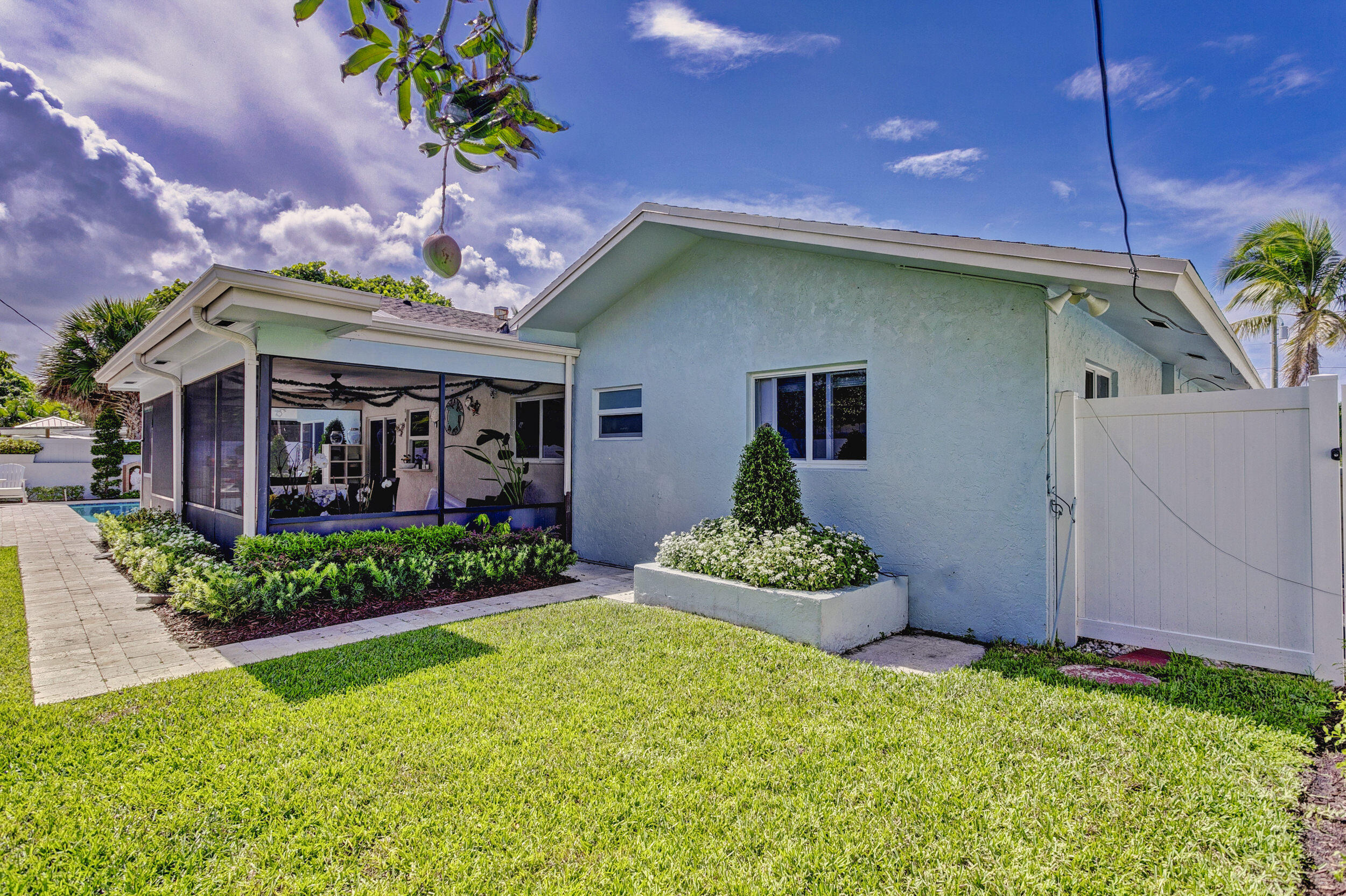 430 Mars Way Juno Beach, FL 33408 - Photo 52 of 65 a front view of a house with garden