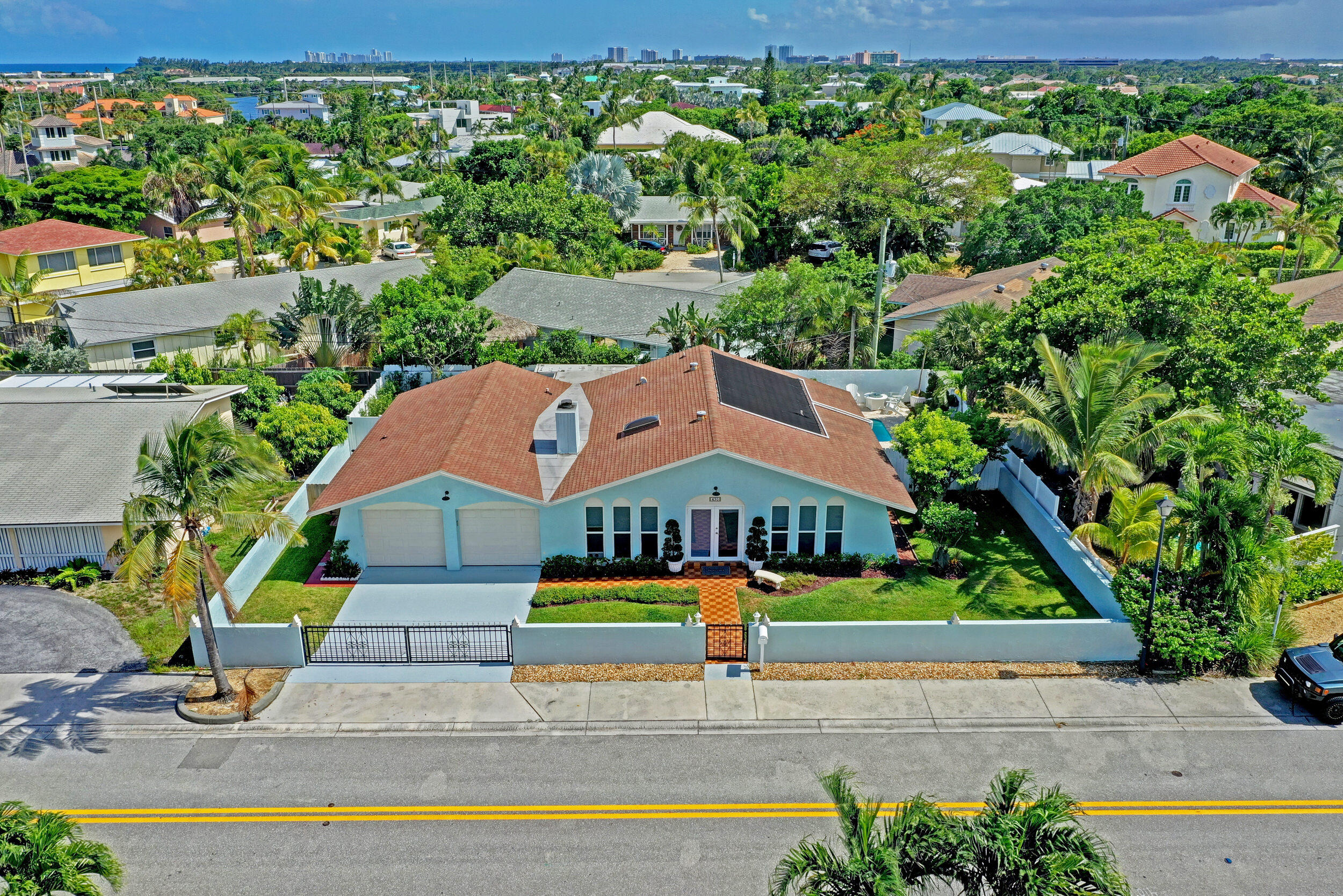 430 Mars Way Juno Beach, FL 33408 - Photo 53 of 65 a aerial view of a house with swimming pool