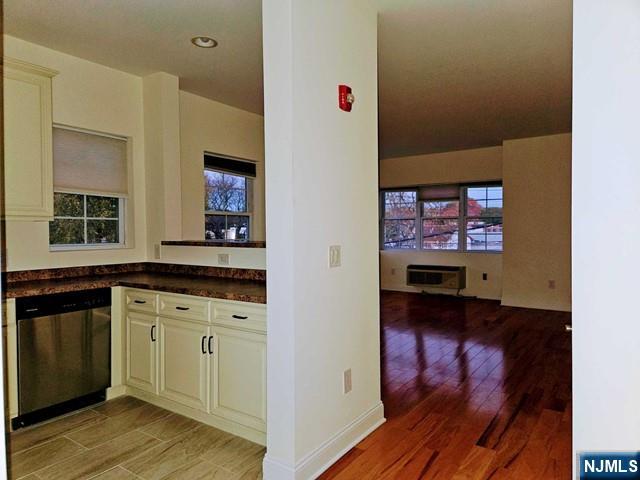 6 Madison Avenue, Unit 303 Cresskill, NJ 07626 - Photo 5 of 12 a view of a kitchen from the hallway