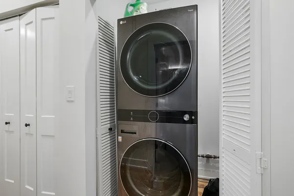 a close view of a utility room with dryer and washer