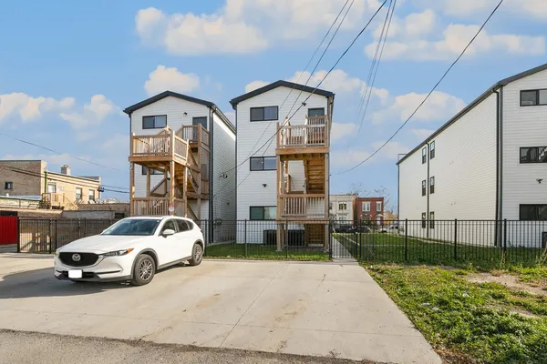 a view of a car parked in front of a house