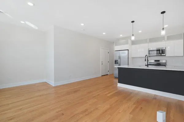 a view of kitchen with wooden floor