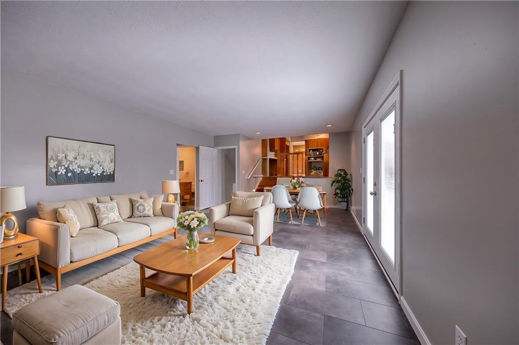 274 Evans Road Zelienople, PA 16063 - Photo 13 of 42 a living room with furniture and a potted plant