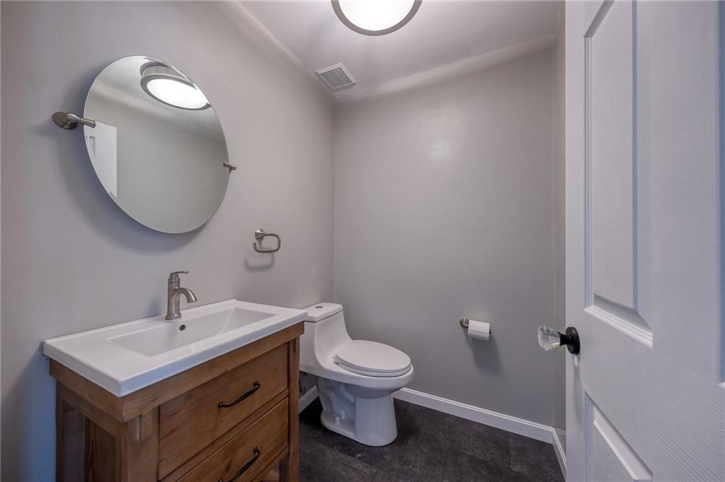 274 Evans Road Zelienople, PA 16063 - Photo 19 of 42 a bathroom with a toilet a sink and mirror