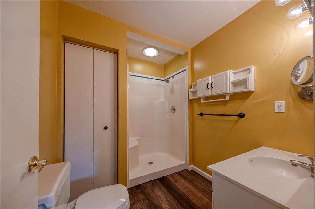 274 Evans Road Zelienople, PA 16063 - Photo 23 of 42 a bathroom with a granite countertop sink toilet and shower