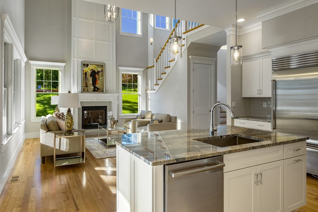 a kitchen with sink cabinets and fireplace