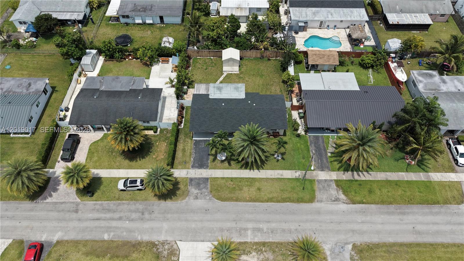 731 Northwest 17th Street Homestead, FL 33030 - Photo 28 of 29 an aerial view of a house with a swimming pool