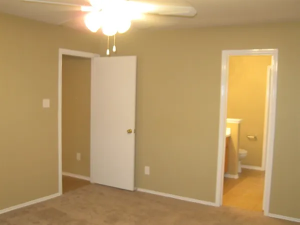 a view of a livingroom and a hallway