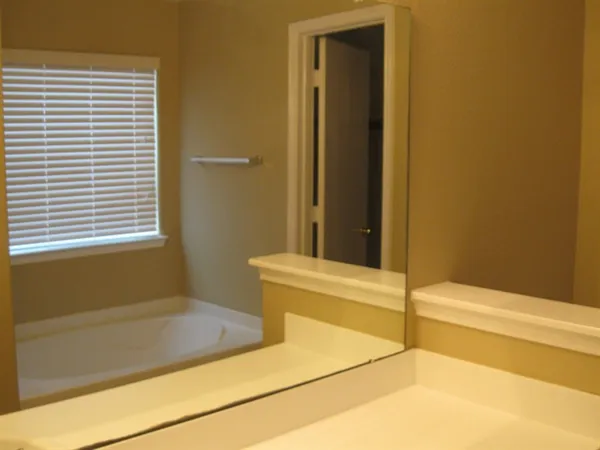 a bathroom with a bathtub and shower