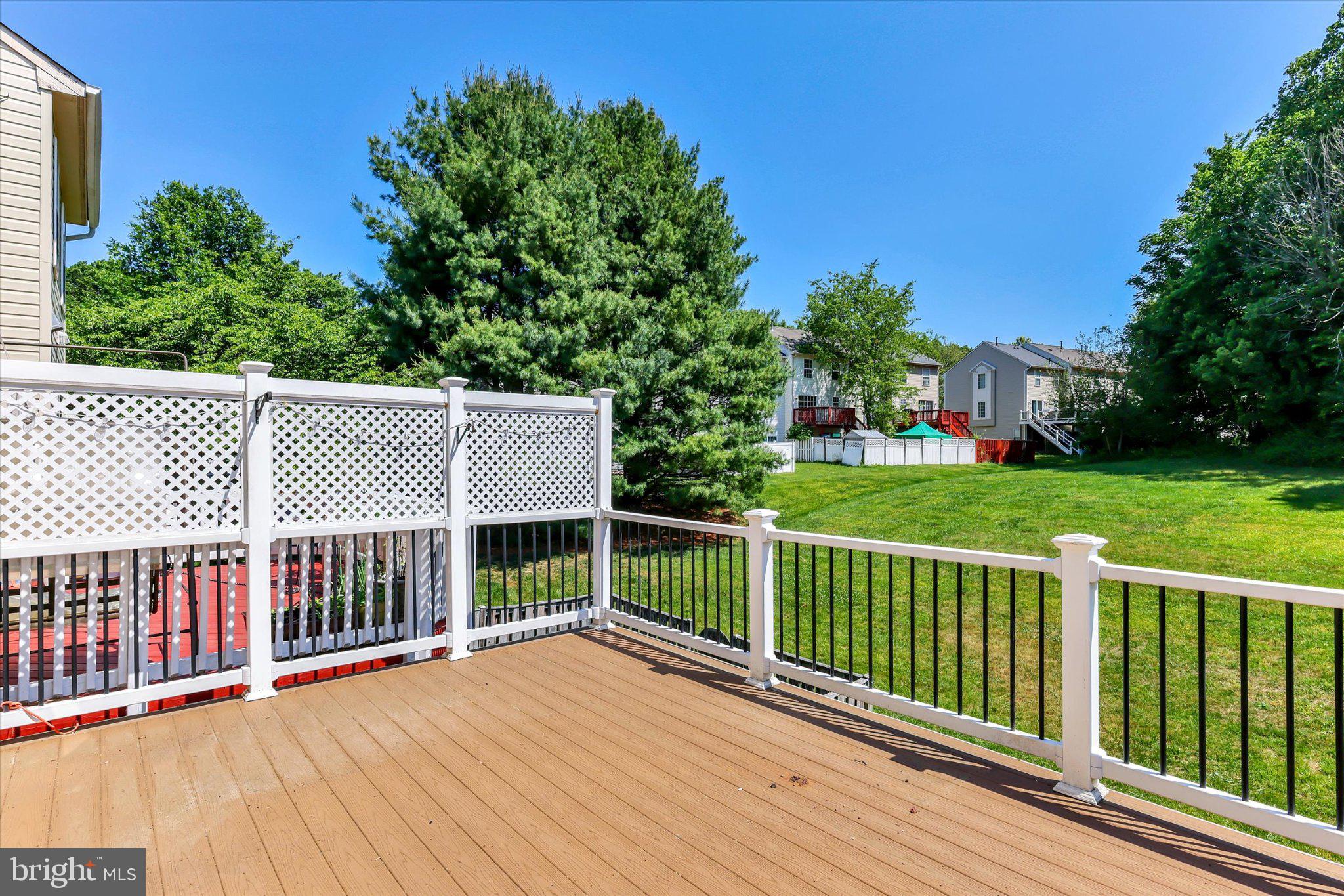 14323 Gate Dancer Lane Boyds, MD 20841 - Photo 15 of 54 Sunny deck with lush green views.