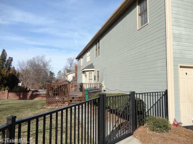 1235 Gatehouse Road High Point, NC 27262 - Photo 16 of 16 Exterior Back. Backyard has a deck and nice fencing.