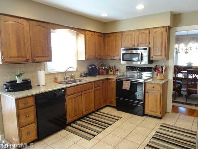 1235 Gatehouse Road High Point, NC 27262 - Photo 6 of 16 Kitchen. Kitchen has granite countertops and is filled with sunlight.