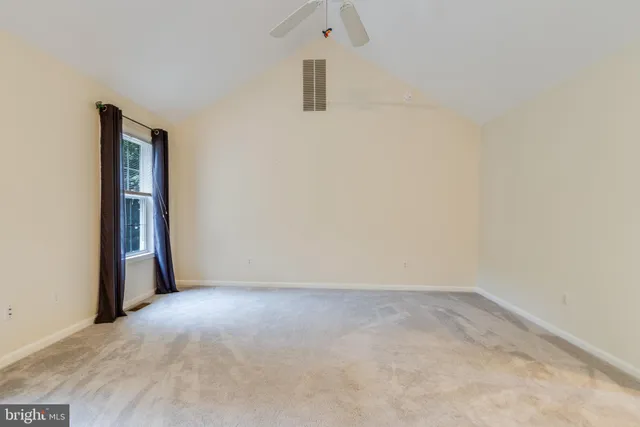 an empty room with a bathroom